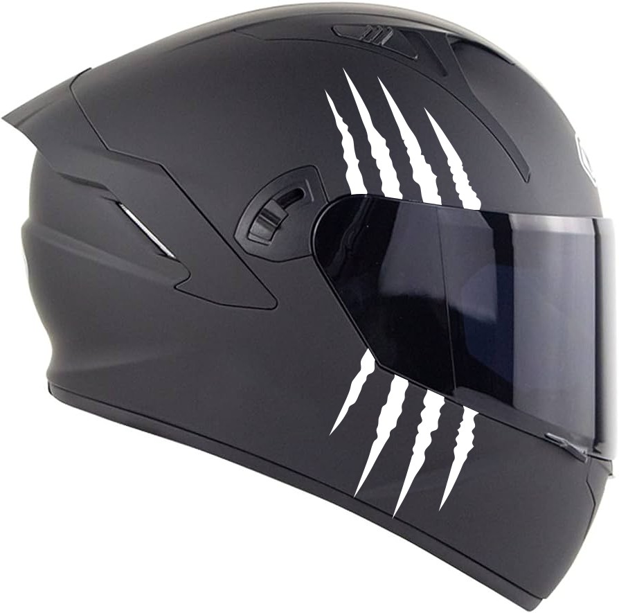 Side view of a black motorcycle helmet with claw marks and visor.
