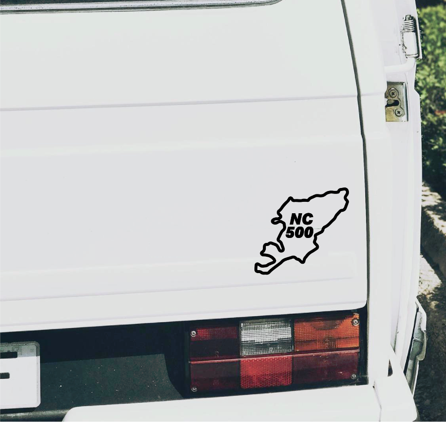 detail close-up of a black north coast 500 sticker for car rear windows