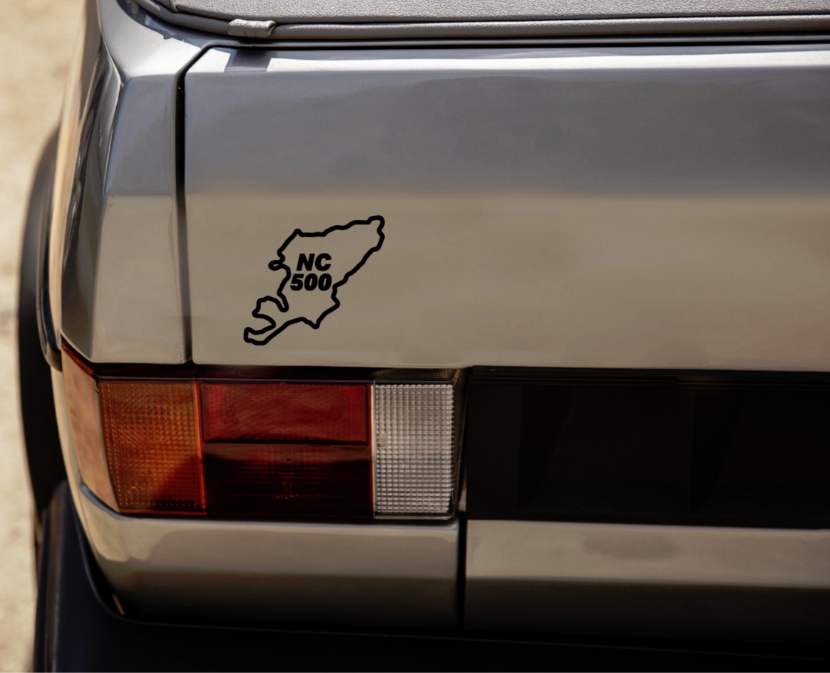 detail close-up of a black north coast 500 sticker for car side windows